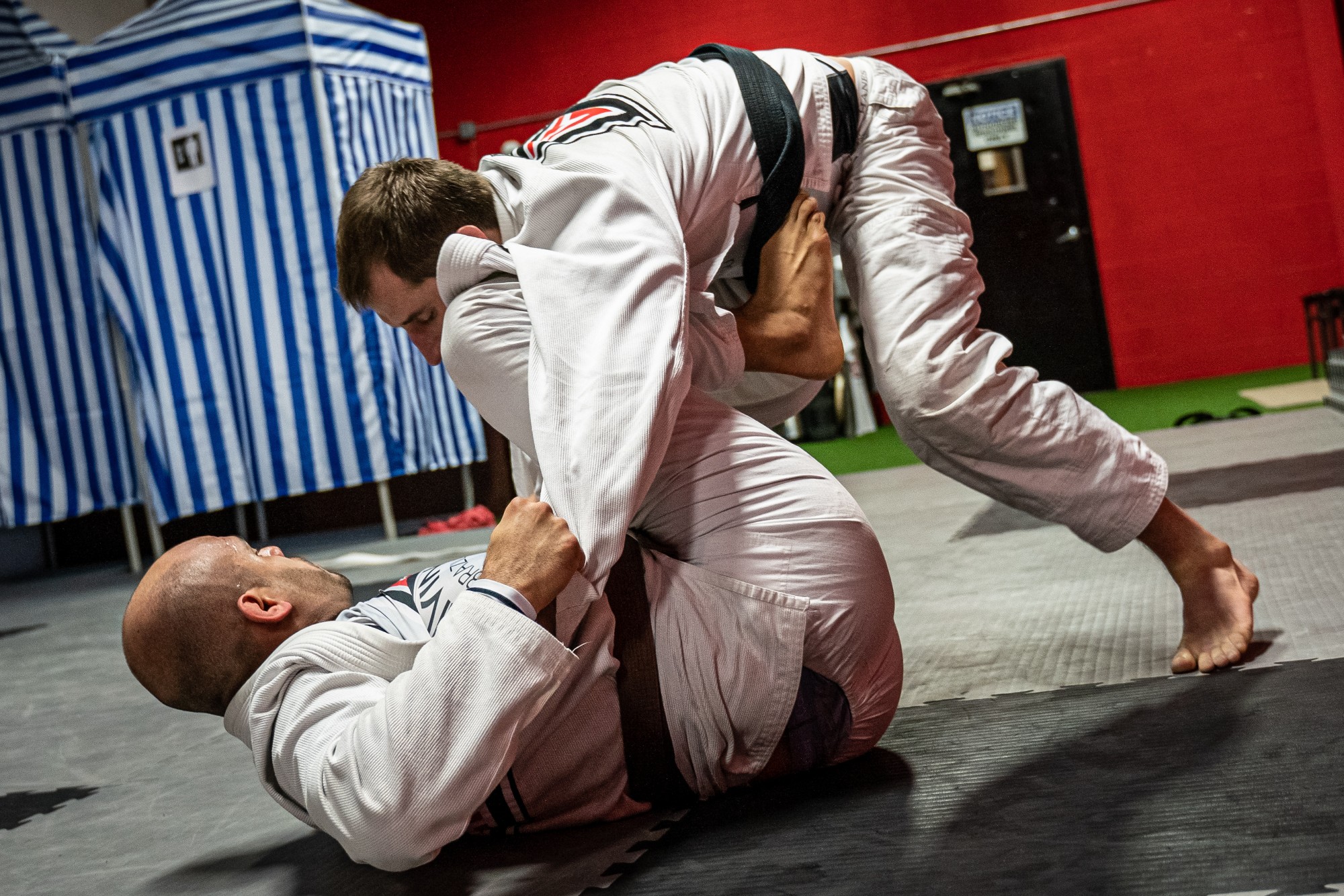 Two adults Brazilian Jiu Jitsu sparring