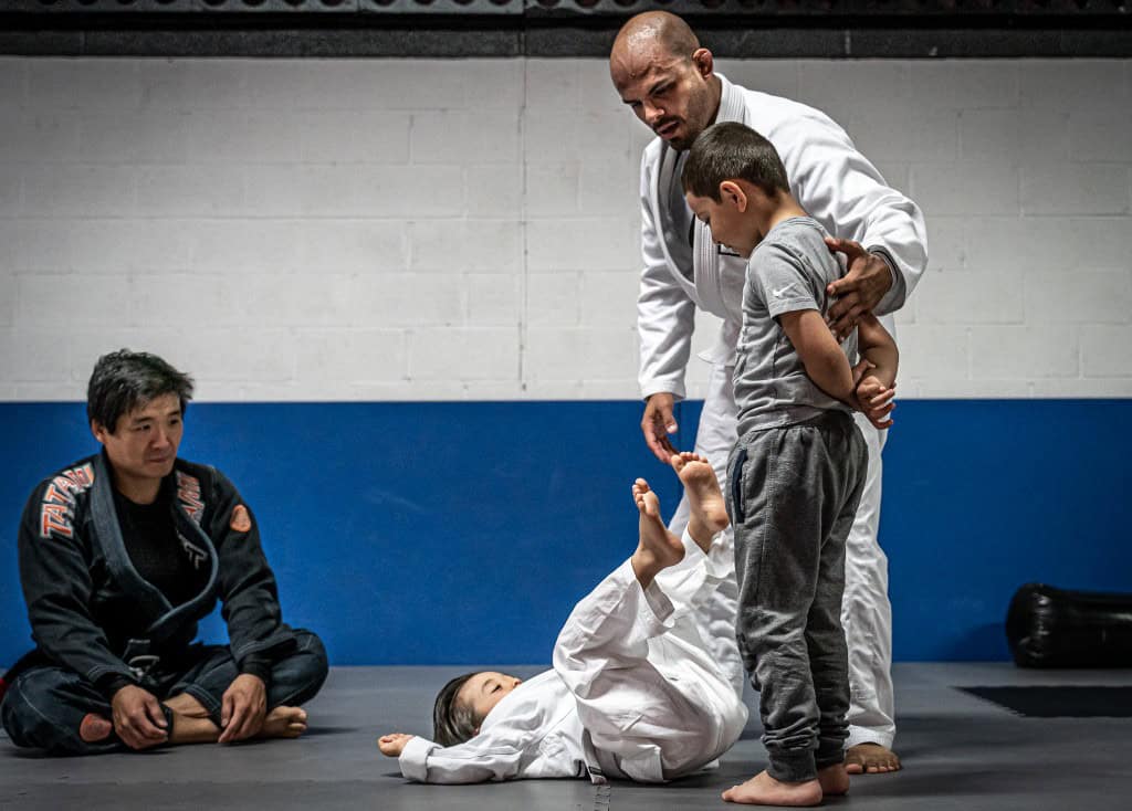 Coach Ramses working with kids at Living Art Brazilian Jiu Jitsu