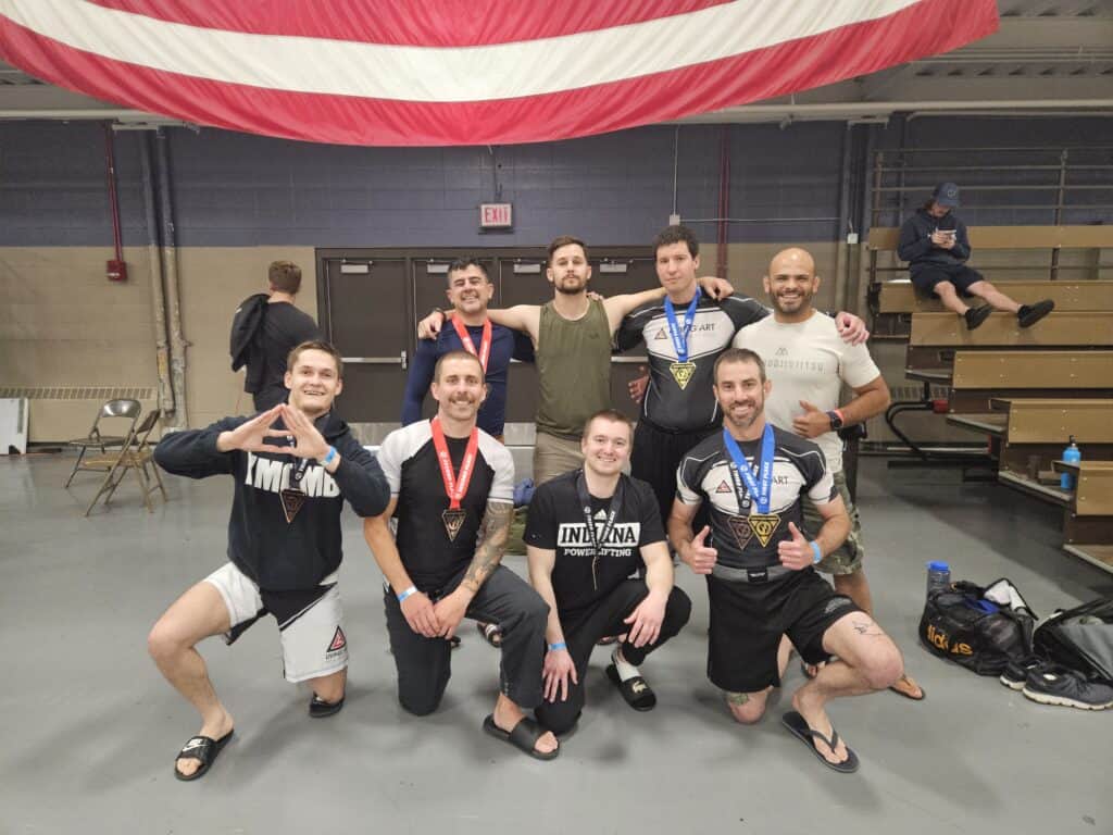 A group photo of some students of Living Art Brazilian Jiu Jitsu after having competed at a local tournament.