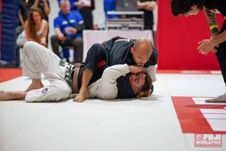 Coach Ramses holding technical mount on an opponent in competition